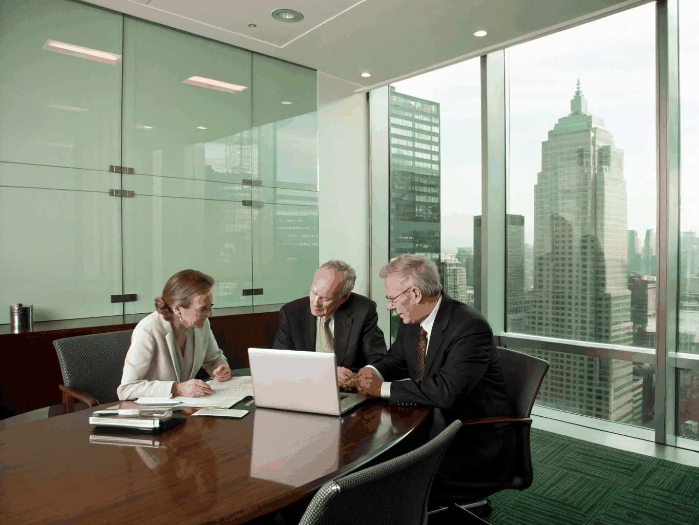 Corporate leaders reviewing strategic partnership plans together